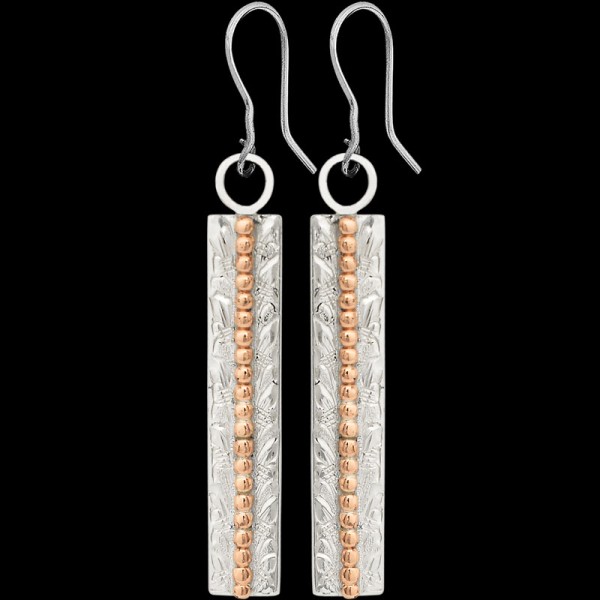 The simple and elegant design of the Dogwood Earrings will pair nicely with any western outfit. Featuring a hand engraved German Silver base and decorated with bronze beads. Order now!